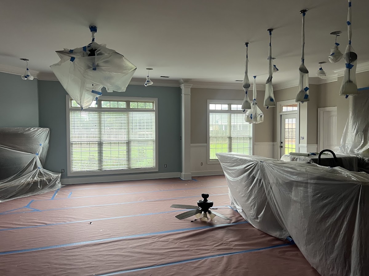 Room covered in plastic sheeting before painting